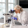 Dr Megan Rossi looking through magnifying glass