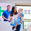 Image of mother and daughter carrying prescription of antibiotics from the pharmacy