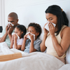 Image of whole family suffering from cold or flu